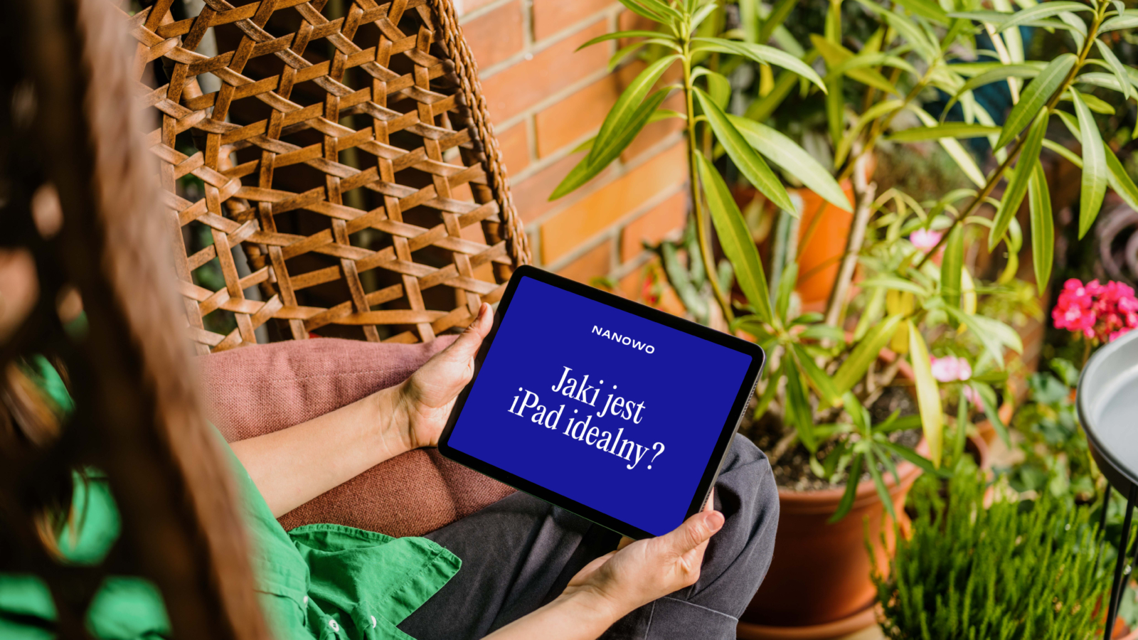 mockuuups-woman-sitting-on-a-hammock-while-holding-an-ipad-air-mockup